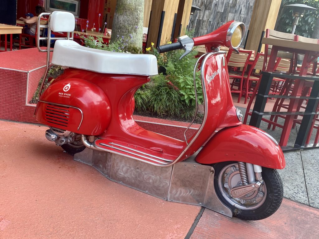 Delivery moped prop at the entrance to Red Oven Pizza Bakery at Universal CityWalk in Orlando, Florida.