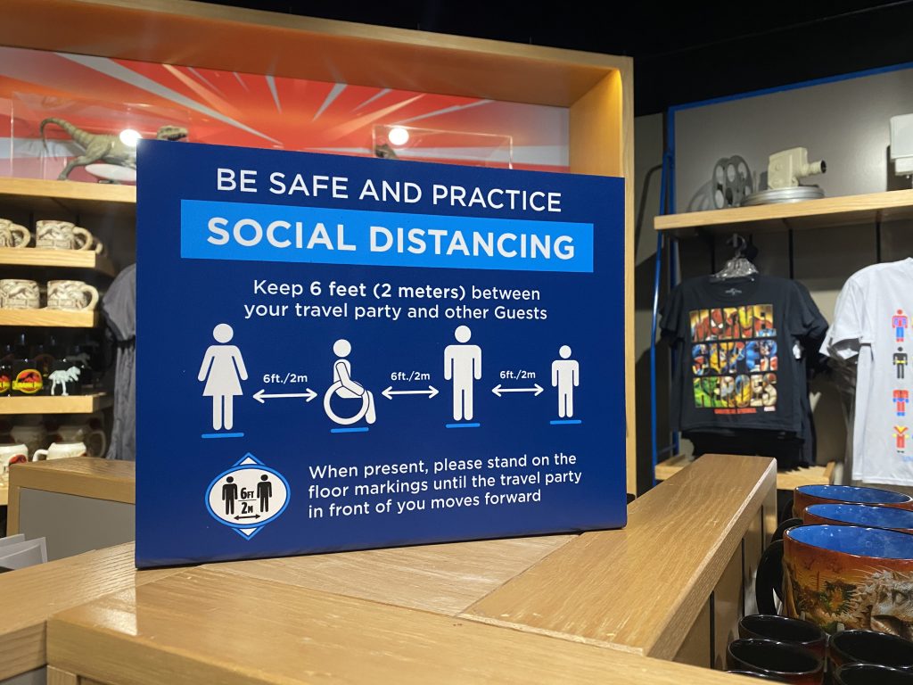 Social distancing sign inside a retail shop at Universal CityWalk in Orlando - by unofficialuniversal.com.